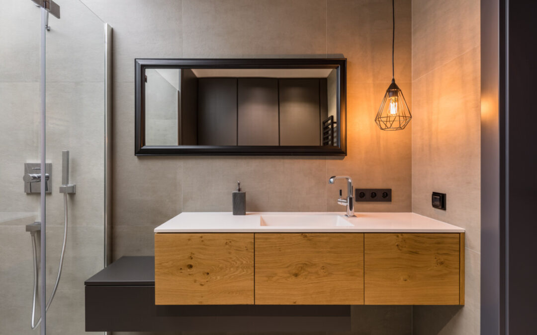 Integral countertop sink on wooden cabinets in contemporary bathroom